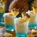 Turquoise Rum, Coconut and Pineapple Shots on a plate