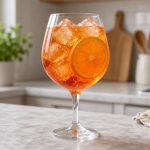 Aperol spritz in a wine glass with an orange slice