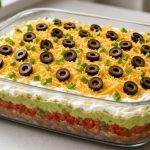 Seven layer dip in a glass dish